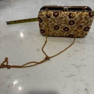 Elegant Gold and Red Floral Clutch